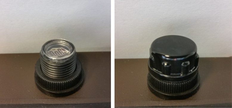  Photocell on a LED wall pack with and without lockout cap.
