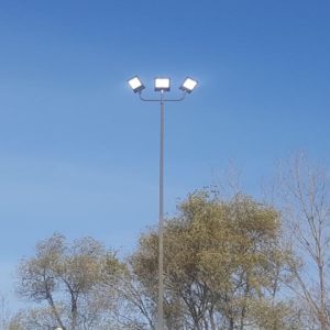 70’ High mast LED parking lot lighting illuminates a massive parking lot