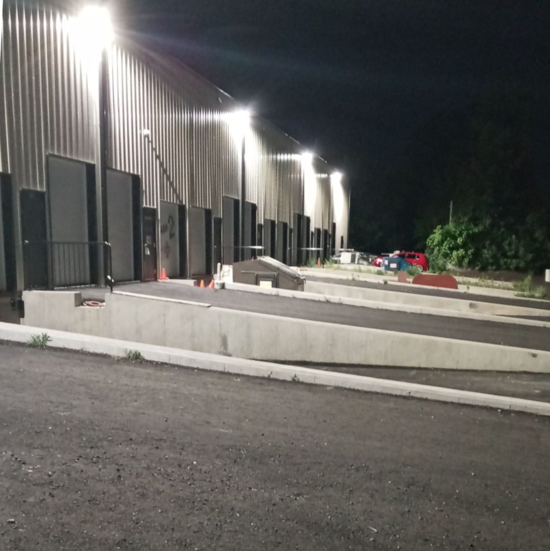 Photo of full cutoff wall packs mounted at 24’ by loading docks